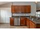 Well-lit kitchen features stainless steel appliances and granite countertops at 12654 Belcroft Dr, Riverview, FL 33579