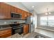 Stylish kitchen featuring stainless steel appliances and granite countertops at 12654 Belcroft Dr, Riverview, FL 33579