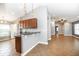 Open concept kitchen with granite countertops and views to the living space at 12654 Belcroft Dr, Riverview, FL 33579