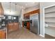 Modern kitchen with stainless steel appliances and granite countertops adjacent to pantry at 12654 Belcroft Dr, Riverview, FL 33579