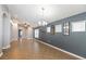 Spacious living room with tiled flooring, neutral paint, and lots of natural light at 12654 Belcroft Dr, Riverview, FL 33579