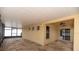 Enclosed patio boasting neutral tones, fan, and screened windows, providing a seamless indoor/outdoor living space at 12654 Belcroft Dr, Riverview, FL 33579