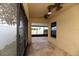 Covered porch featuring stone floors and ceiling fans; access to yard and screened-in porch at 12654 Belcroft Dr, Riverview, FL 33579