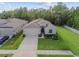 Beautiful aerial view of the home, backyard, and lake in a serene neighborhood at 15354 Sweet Springs Bnd, Odessa, FL 33556