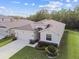 Beautiful aerial view of a single-story home with a landscaped lawn and an attached two car garage at 15354 Sweet Springs Bnd, Odessa, FL 33556