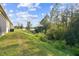 Large grassy backyard with scenic lake views and natural surroundings at 15354 Sweet Springs Bnd, Odessa, FL 33556