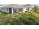 Screened in porch overlooks the spacious and well-maintained lawn at 15354 Sweet Springs Bnd, Odessa, FL 33556