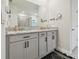 Modern bathroom featuring double sinks, a sleek vanity, and updated fixtures at 15354 Sweet Springs Bnd, Odessa, FL 33556