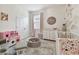 Bedroom featuring floral wallpaper and plenty of natural light at 15354 Sweet Springs Bnd, Odessa, FL 33556