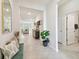 Inviting entryway with tile flooring, bench seating, and views into the living areas at 15354 Sweet Springs Bnd, Odessa, FL 33556