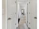 Hallway view showcasing the home's neutral color palette and clean design at 15354 Sweet Springs Bnd, Odessa, FL 33556