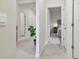 Bright hallway with light neutral colors leads to bedrooms at 15354 Sweet Springs Bnd, Odessa, FL 33556