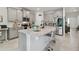 Stylish kitchen features a large island with granite countertops, stainless steel appliances, and ample cabinet space at 15354 Sweet Springs Bnd, Odessa, FL 33556