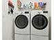 Modern laundry room with front load washer and dryer at 15354 Sweet Springs Bnd, Odessa, FL 33556
