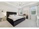 An elegant primary bedroom suite with a tray ceiling and ample natural light at 15354 Sweet Springs Bnd, Odessa, FL 33556