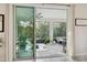 Covered patio with expansive views, featuring outdoor seating, tile flooring, and lots of natural light at 15354 Sweet Springs Bnd, Odessa, FL 33556