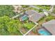 A beautiful screened-in pool surrounded by lush landscaping and a well-maintained yard at 2912 Aston Ave, Plant City, FL 33566