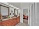 Dual vanity bathroom featuring a separate water closet and a doorway to the main bedroom at 2912 Aston Ave, Plant City, FL 33566