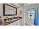 Well-lit bathroom featuring a granite countertop and coordinated window decor at 2912 Aston Ave, Plant City, FL 33566