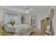 Cozy bedroom with a ceiling fan, built-in shelves, and generous closet space at 2912 Aston Ave, Plant City, FL 33566