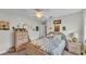 Serene bedroom with a ceiling fan and wicker furniture at 2912 Aston Ave, Plant City, FL 33566