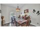 Formal dining room featuring natural light and modern decor at 2912 Aston Ave, Plant City, FL 33566