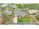 Charming home featuring a well-manicured lawn, mature landscaping, and a screened-in pool for outdoor enjoyment at 2912 Aston Ave, Plant City, FL 33566