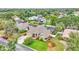Beautiful home featuring a manicured lawn, mature trees, and a screened-in pool for outdoor enjoyment at 2912 Aston Ave, Plant City, FL 33566