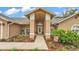 Inviting front porch with rocking chairs and charming landscaping at 2912 Aston Ave, Plant City, FL 33566