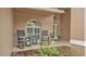 Front porch features chairs, plantings and attractive landscaping at 2912 Aston Ave, Plant City, FL 33566