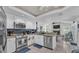 Bright kitchen featuring white cabinets, stainless steel appliances, and an open layout flowing into the living area at 2912 Aston Ave, Plant City, FL 33566