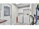 Functional laundry room featuring a full-size washer and dryer at 2912 Aston Ave, Plant City, FL 33566