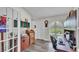 Home office featuring built-in desk, natural light from arch window, and luxury vinyl plank flooring at 2912 Aston Ave, Plant City, FL 33566