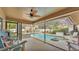 Enclosed pool and patio featuring a fan and room for entertaining at 2912 Aston Ave, Plant City, FL 33566