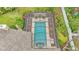 A beautiful screened-in pool featuring an elegant design and surrounding landscaping at 2912 Aston Ave, Plant City, FL 33566