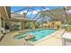 A screened-in pool and spa provides ample space for entertaining at 2912 Aston Ave, Plant City, FL 33566