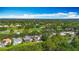 Beautiful aerial view of neighborhood homes situated along a tranquil pond and golf course at 3620 Cordgrass Dr, Valrico, FL 33596