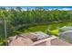 Picturesque aerial view of home overlooking a serene pond surrounded by lush greenery at 3620 Cordgrass Dr, Valrico, FL 33596