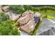 Aerial view of a beautiful home with solar panels, a screened pool, and a private backyard at 3620 Cordgrass Dr, Valrico, FL 33596
