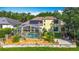 Serene backyard featuring a screened pool, solar panels, a stone patio and beautiful landscaping at 3620 Cordgrass Dr, Valrico, FL 33596