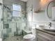Updated bathroom showcasing new tiles, glass shower, and modern fixtures at 3620 Cordgrass Dr, Valrico, FL 33596