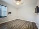 Bedroom featuring a ceiling fan, window, and wall-mounted entertainment center at 3620 Cordgrass Dr, Valrico, FL 33596