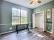 Bedroom features include a ceiling fan, double-hung window, and closet with shelving and hanging at 3620 Cordgrass Dr, Valrico, FL 33596