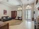 Inviting foyer featuring high ceilings, tile floors, and elegant double entry doors at 3620 Cordgrass Dr, Valrico, FL 33596