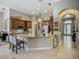 Spacious kitchen with granite countertops, stainless steel appliances, and custom cabinetry at 3620 Cordgrass Dr, Valrico, FL 33596