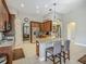 Well-equipped kitchen with granite countertops, stainless steel appliances, and breakfast bar seating at 3620 Cordgrass Dr, Valrico, FL 33596