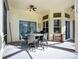Covered patio with patio furniture and a ceiling fan. The perfect spot for relaxing at 3620 Cordgrass Dr, Valrico, FL 33596