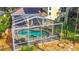 Screened-in pool and spa with outdoor seating provides a relaxing backyard retreat at 3620 Cordgrass Dr, Valrico, FL 33596