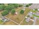 Broad aerial image displaying a fenced-in property with a home, outbuildings, and mature trees at 3715 Fortner Rd, Plant City, FL 33567