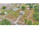 Extensive aerial shot of a large fenced-in property featuring a residence, outbuildings, and tall trees at 3715 Fortner Rd, Plant City, FL 33567